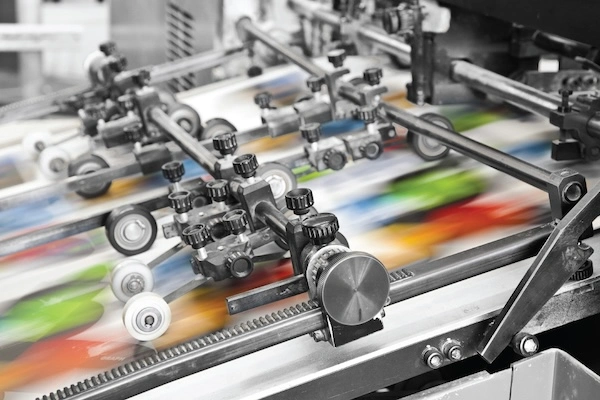 Offset Printing Press in Black and White with Colored Inks;